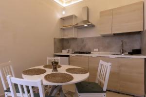 Kuchyň nebo kuchyňský kout v ubytování Mariù Loft & Apartments + 17 fotografií