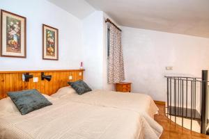 Posteľ alebo postele v izbe v ubytovaní Apartaments Can Niell