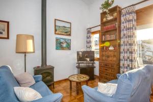 Televízia a/alebo spoločenská miestnosť v ubytovaní Apartaments Can Niell
