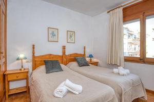 Posteľ alebo postele v izbe v ubytovaní Apartaments Can Niell
