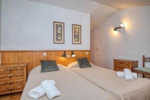Posteľ alebo postele v izbe v ubytovaní Apartaments Can Niell