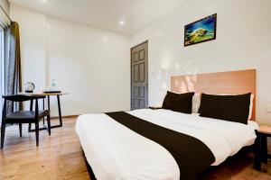 Postel nebo postele na pokoji v ubytování Super Hotel O Britania Chowk + 21 fotografií