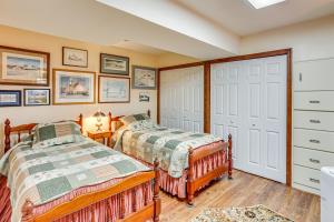 a bedroom with two beds and a closet at Charming Apartment with Yard and Beautiful Gardens! in Manheim