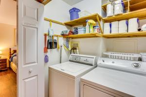 a laundry room with a washing machine and cabinets at Charming Apartment with Yard and Beautiful Gardens! in Manheim +32 photos