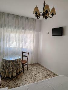 Un televizor și/sau centru de divertisment la Casa Nijar