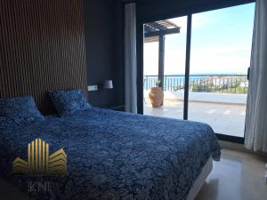 a bedroom with a bed and a large window at Exclusive Penthouse Privacy and Sea View in Vistamar KniTorroxCosta in Torrox Costa +20 photos