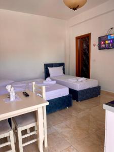Postel nebo postele na pokoji v ubytování Kristeo`s Apartaments