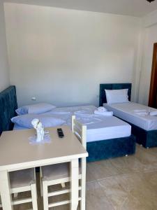 Postel nebo postele na pokoji v ubytování Kristeo`s Apartaments
