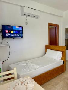 Postel nebo postele na pokoji v ubytování Kristeo`s Apartaments