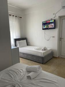 Postel nebo postele na pokoji v ubytování Kristeo`s Apartaments