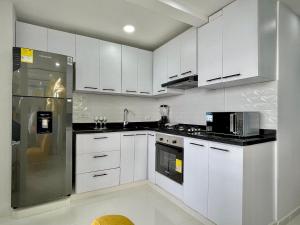 Kuchyň nebo kuchyňský kout v ubytování Apartamento con vista única cerca de la Uninorte