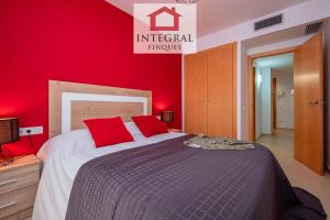 En eller flere senge i et værelse på Sakura Apartment Palamós