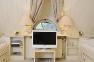 TV a/nebo společenská místnost v ubytování Benendikenwai 11