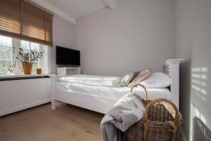 Giường trong phòng chung tại Munkmarscher Chaussee 7