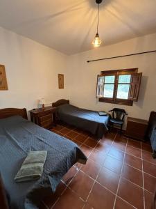 Ένα ή περισσότερα κρεβάτια σε δωμάτιο στο Casa Rural Arroyo de la Puerta +27 φωτογραφίες