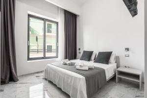 A bed or beds in a room at La Corte dei Pozzi