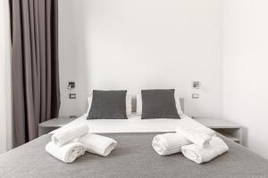A bed or beds in a room at La Corte dei Pozzi