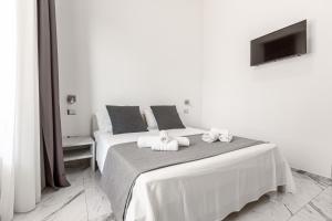 A bed or beds in a room at La Corte dei Pozzi
