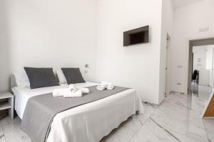 A bed or beds in a room at La Corte dei Pozzi