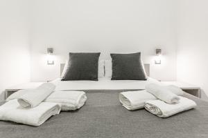 A bed or beds in a room at La Corte dei Pozzi