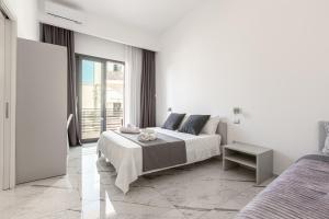 A bed or beds in a room at La Corte dei Pozzi