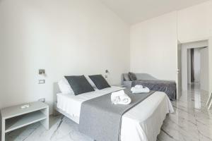 A bed or beds in a room at La Corte dei Pozzi