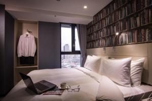 Postel nebo postele na pokoji v ubytování Yi Su Hotel-Taipei Ningxia