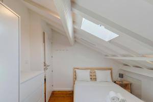 En eller flere senge i et værelse på Casa Bestel Setúbal