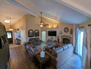 a large living room with couches and a fireplace at Candlewood Creek in Paso Robles