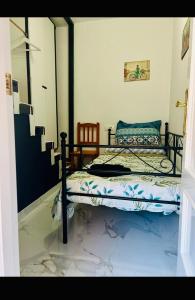 a bedroom with a bed with a laptop on it at Casa Adela in Barbate