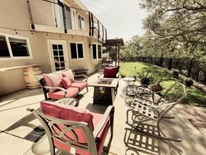 a patio with chairs and a couch and a table at Candlewood Creek in Paso Robles