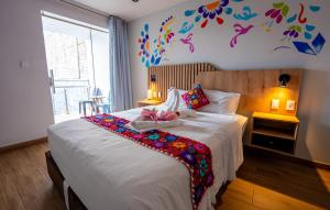 Postel nebo postele na pokoji v ubytování Platero Hotel