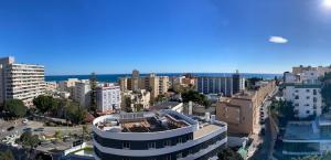 an aerial view of a city with buildings at Apartamento Mirando in Torremolinos +11 photos