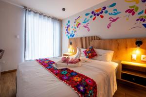 Postel nebo postele na pokoji v ubytování Platero Hotel