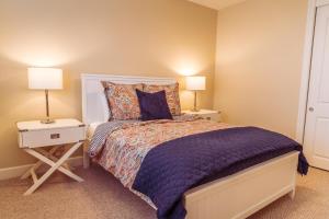 a bedroom with a large bed with two night stands at Red Cloud Rendezvous in Paso Robles