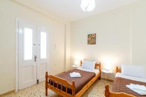 Postel nebo postele na pokoji v ubytování Aloe Apartments