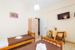 Postel nebo postele na pokoji v ubytování Aloe Apartments