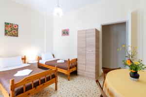 Postel nebo postele na pokoji v ubytování Aloe Apartments