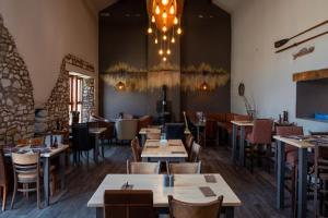 a restaurant with tables and chairs and a dining room at 11 Borwick Lakes in Carnforth