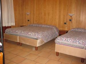 Postel nebo postele na pokoji v ubytování Albergo "da Tosca"