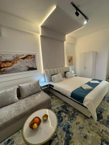a hotel room with a bed and a couch at Strumica Jordan Luxury apartments in Strumica