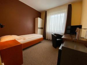 Postel nebo postele na pokoji v ubytování Adamidis Hotel