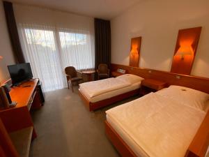Postel nebo postele na pokoji v ubytování Adamidis Hotel