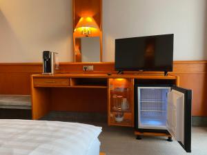 TV a/nebo společenská místnost v ubytování Adamidis Hotel