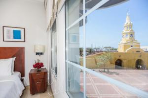 Postel nebo postele na pokoji v ubytování NH Royal Urban Cartagena