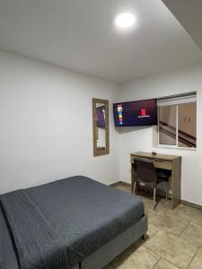A bed or beds in a room at Hostelfc San Luis