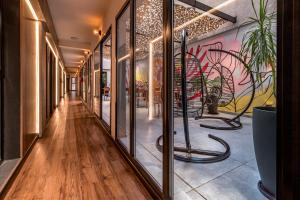 a corridor of a store with a mural on the wall at Up Barrio Norte in Buenos Aires