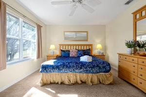 A bed or beds in a room at The Regal Palms Resort With Lazy River and Arcade Games