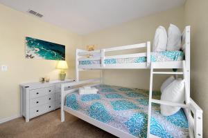 A bed or beds in a room at The Regal Palms Resort With Lazy River and Arcade Games