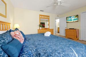 A bed or beds in a room at The Regal Palms Resort With Lazy River and Arcade Games